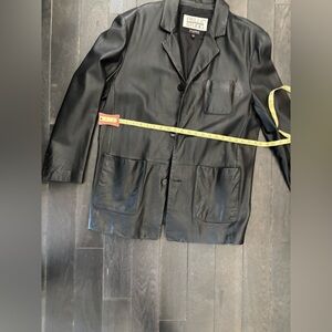 Wilson’s black leather jacket. Great shape.